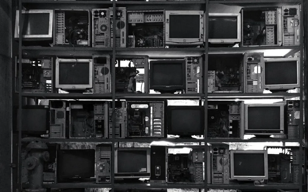 Row of old CRT computer monitors, one of the WEEE product categories with its own collection targets