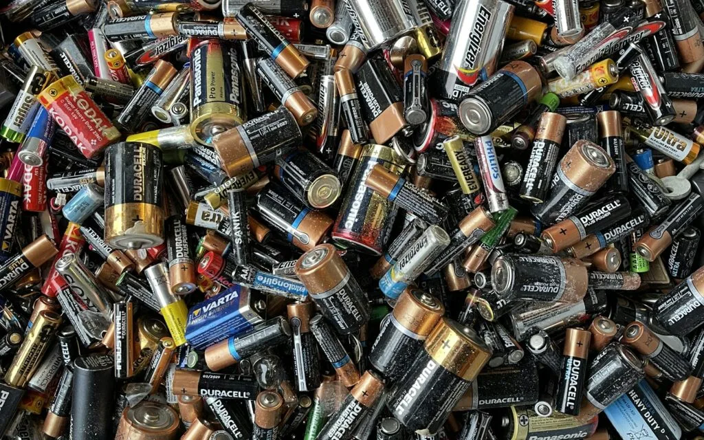 Pile of used batteries of different types that must be collected separately for recycling