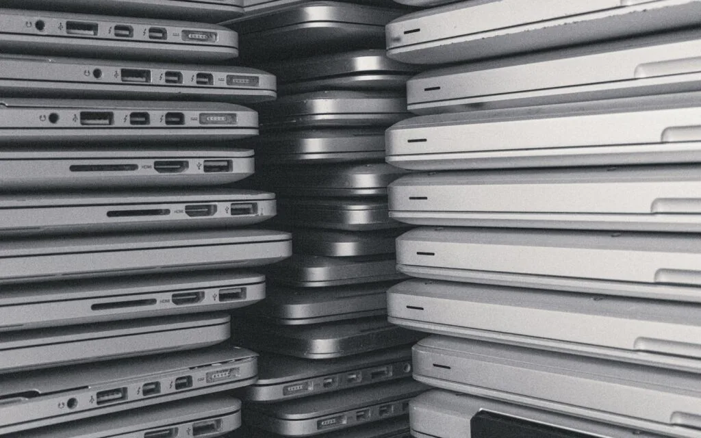 Room filled with retired laptops awaiting IT asset disposition and refurbishment